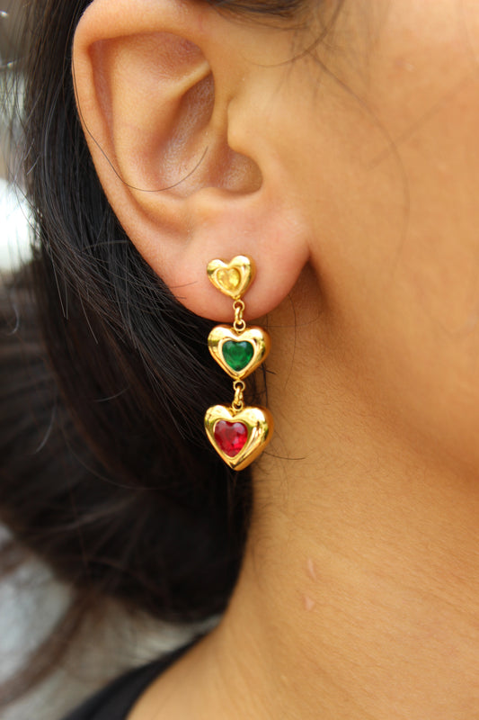 Close-up of an ear wearing a Hearts in Hue Earrings with heart-shaped gemstones
