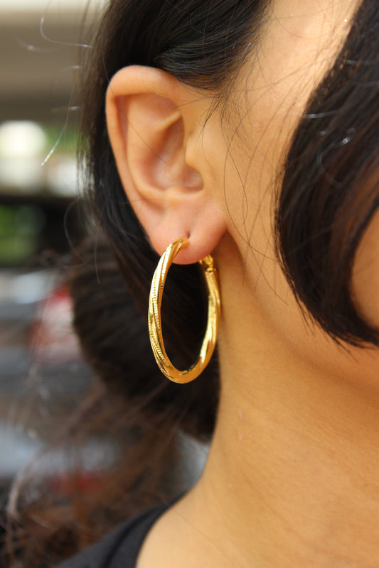 Lightweight trendy gold hoop earrings on model