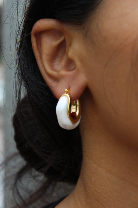 Mira Pearl Hoop Earrings on model's ear
