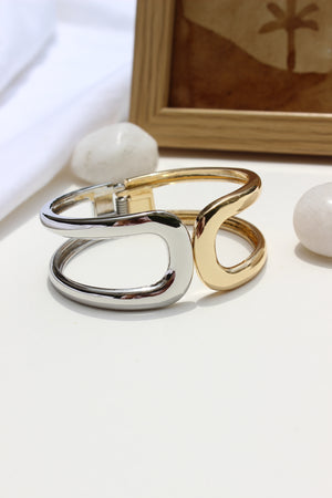 Soft Armour Bracelet on a white surface with a blurred background