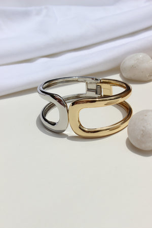 Soft Armour Bracelet hanging on a white surface