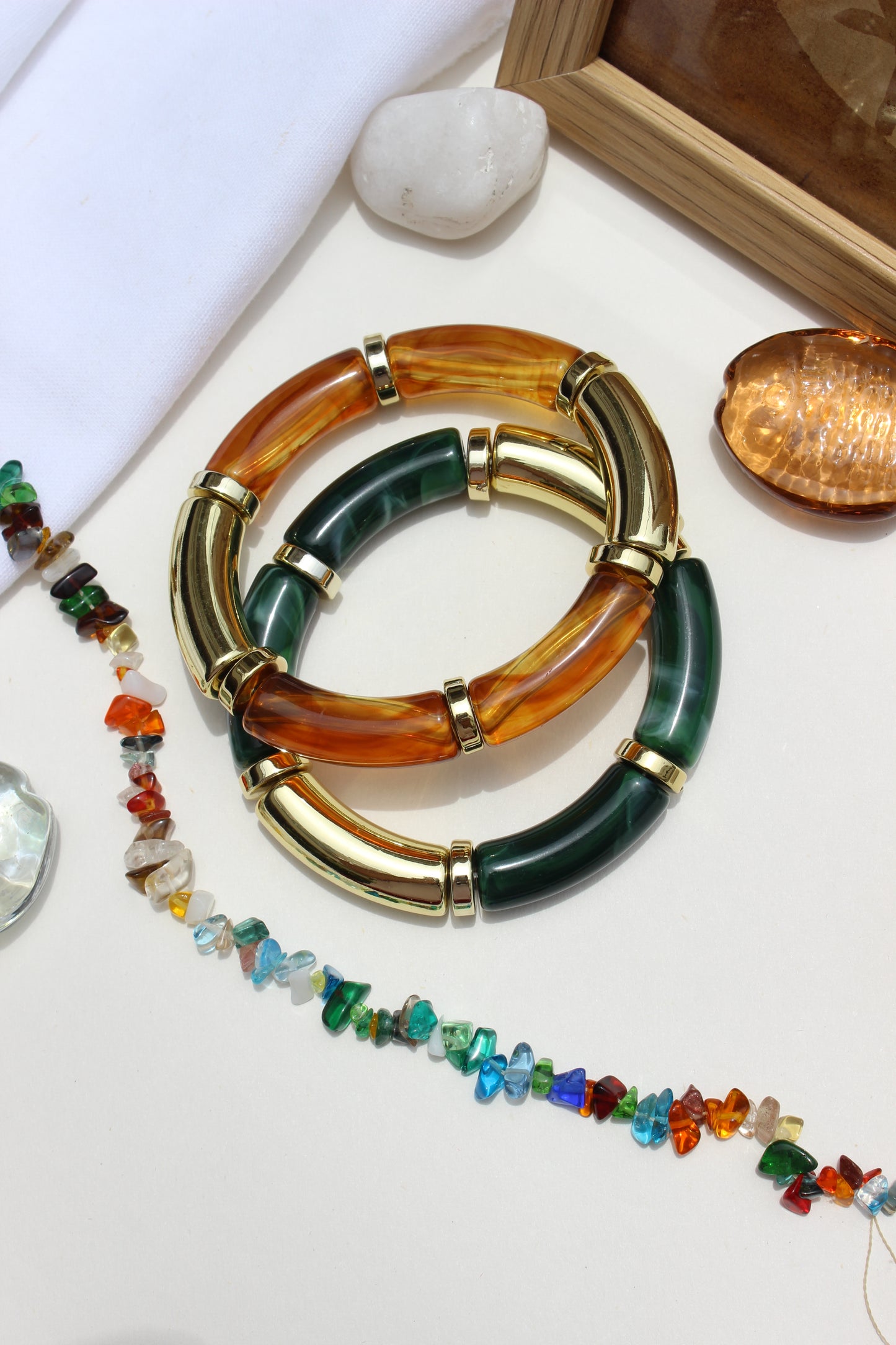 Amazonia Bangle Bracelets on a grey surface