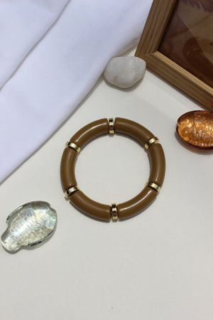 Mocha Toffee Bangle Bracelet on a white surface with decorative stones