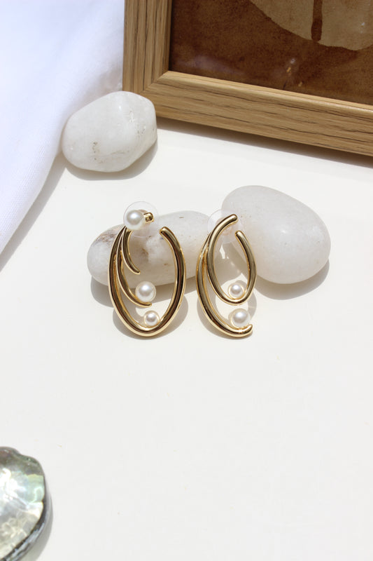 Not quite Twins Earrings on a light surface