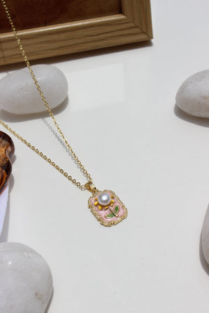 Petal of the Ocean Pendant Necklace with a pearl-like bead on a light background