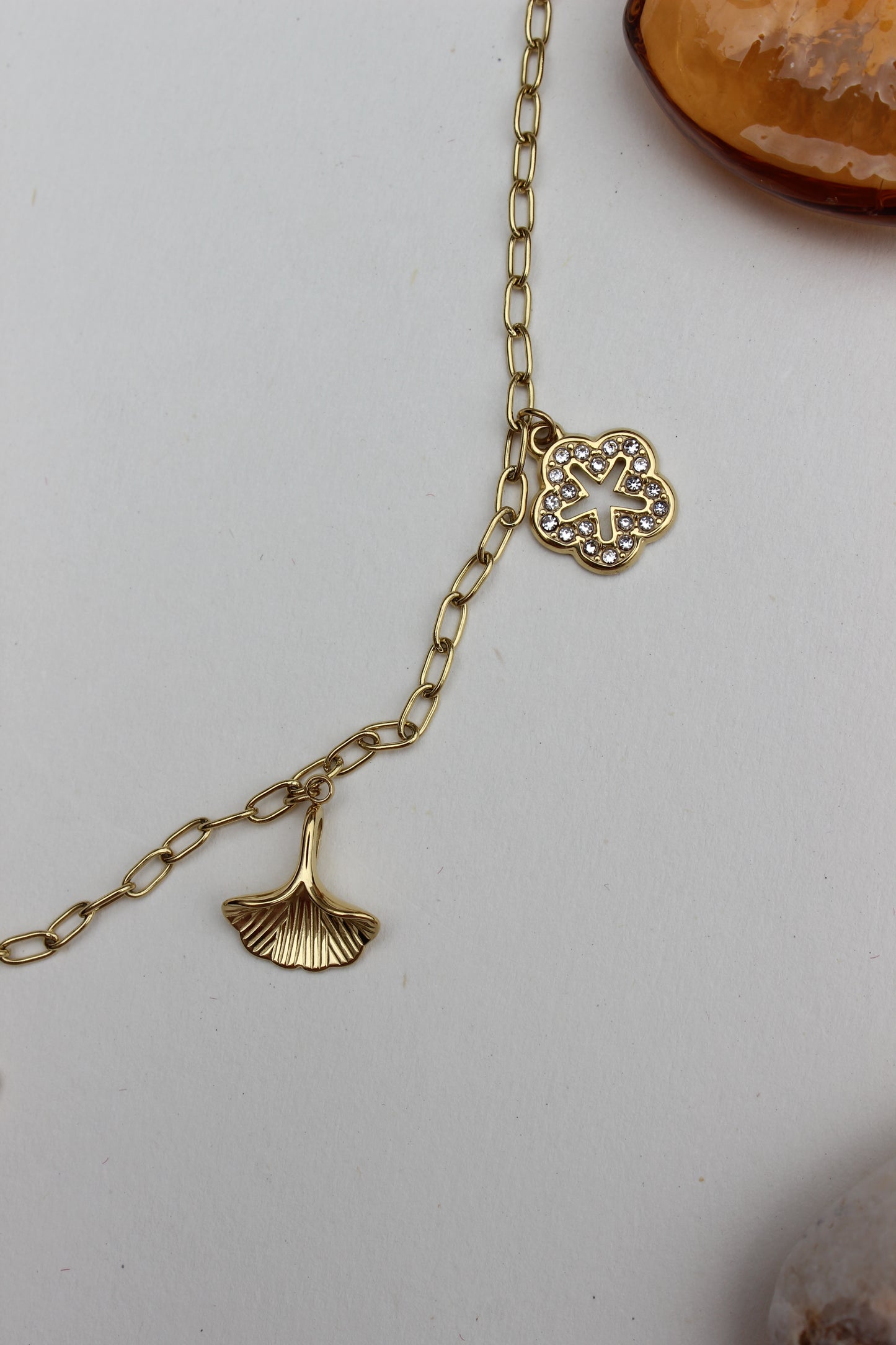 Where She Wanders Charm Necklace with a decorative clasp on a light gray background