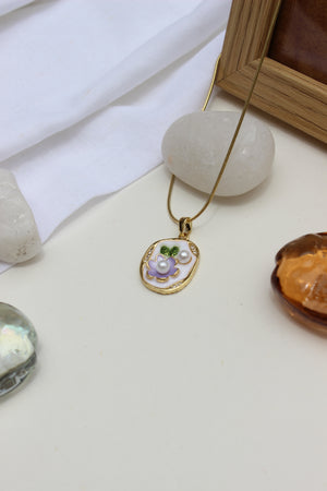 Elegant 18k gold-plated wildflower necklace styled with white stones and amber gem
