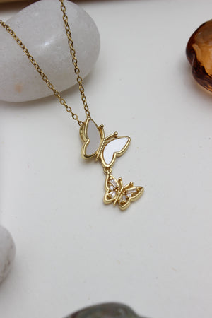 Clarisee Pendant Necklace on white stone