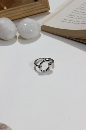 Lunar Trace Ring on a white surface with a blurred background