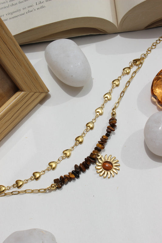 Rootlight Layered Bracelet on a white surface with stones