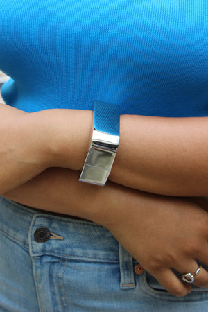 Lucid Hour Bracelet on a wrist with a blue shirt and jeans background