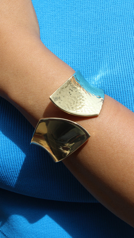 Sculpted Quiet Bracelet on a wrist with a blue background