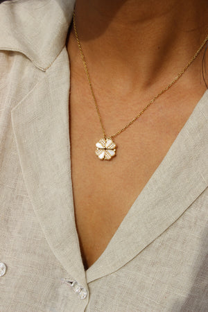 Oyster Petal Pendant Necklace on a model wearing a beige top