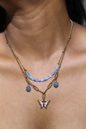 Butterbead Layered Necklace on a model's neck