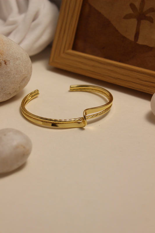 Ouro Cuff Bracelet on a neutral background