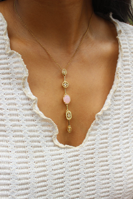 Rosaline Dawn Necklace on a model with white top