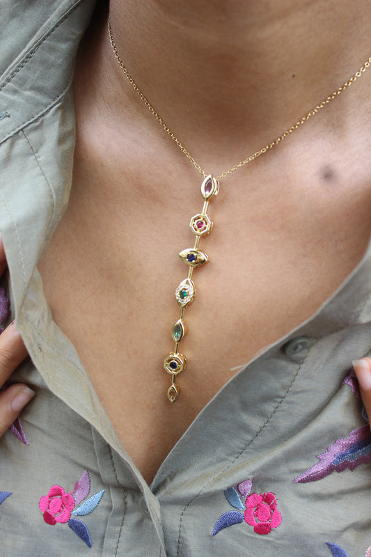 Lustre Pour Necklace with colorful gemstones on a model's neck