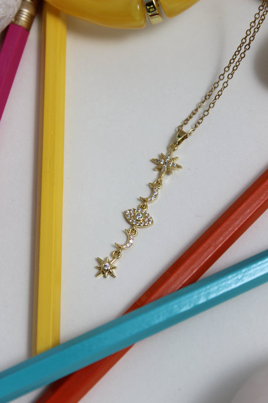 Stellar Sky Necklace on a white background with colorful pencils
