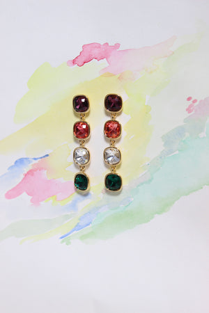 Rosette Meadow Earrings with colorful gemstones on a watercolor background