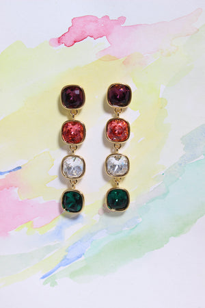 Rosette Meadow Earrings on a watercolor background