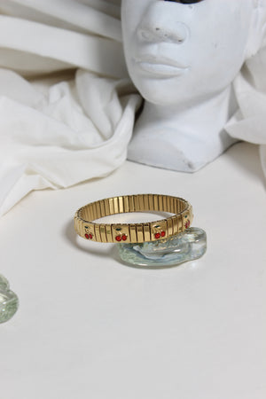 Cherry Twist Bracelet on a white surface