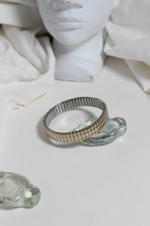 Dual Harmony Bracelet on a white marble bust