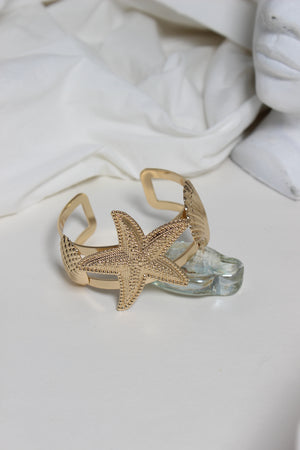 Golden Tide Cuff Bracelet on a white surface