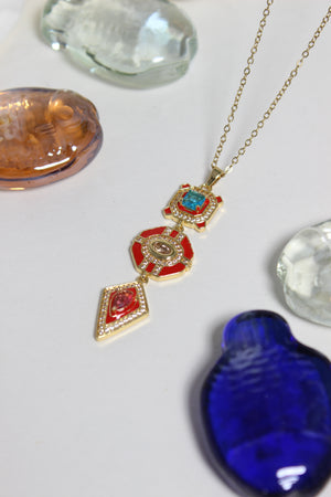 Inferno Charm Necklace on a light gray background