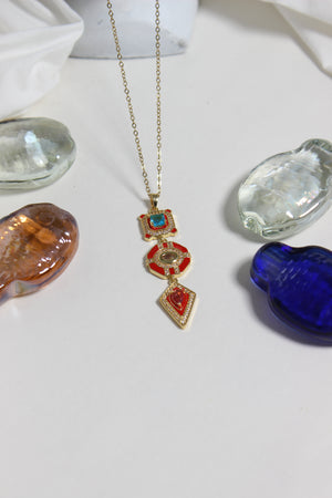 Inferno Charm Necklace on a white surface