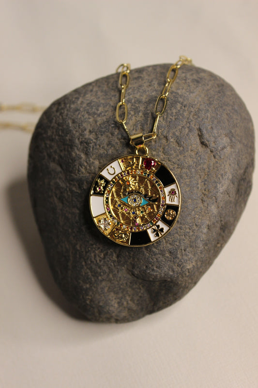 Mystic Halo Pendant Necklace on a gray stone surface