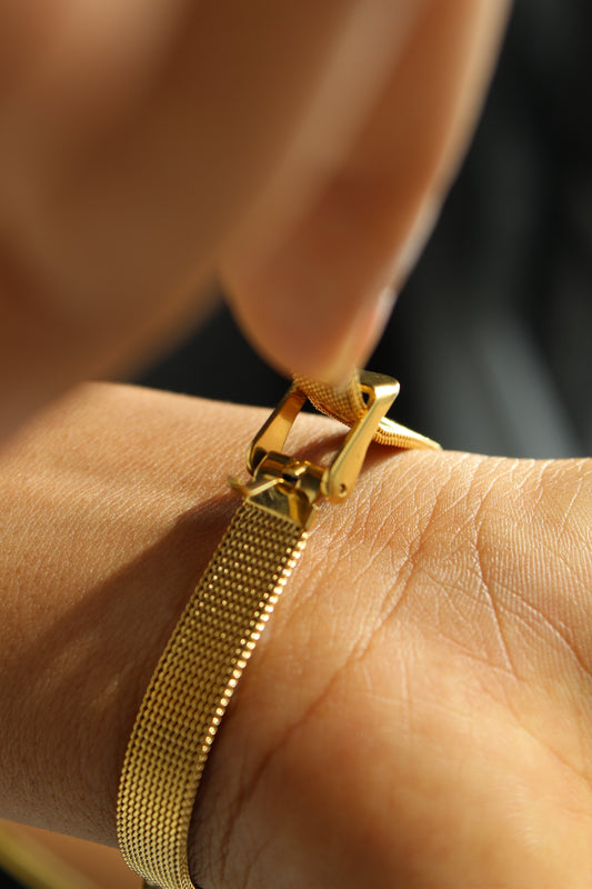 SolBee Watch Bracelet on a wrist with a blurred background