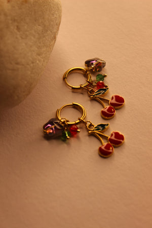 Cherelle Hoop Earrings on a yellow background