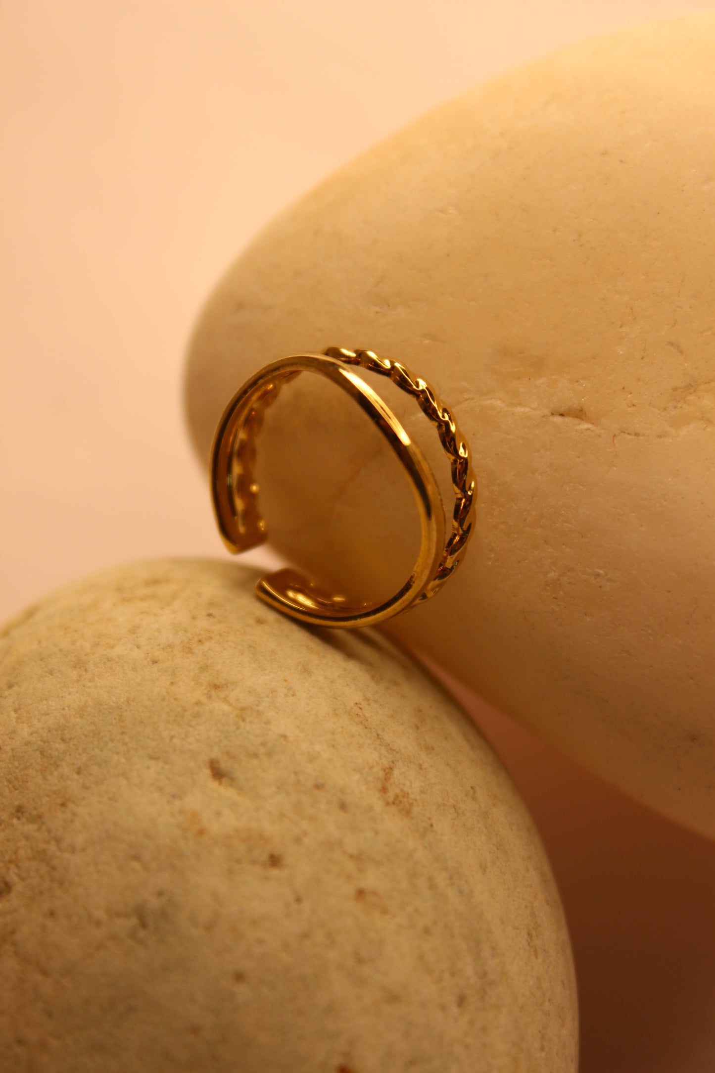 Drift Ring on a textured beige surface