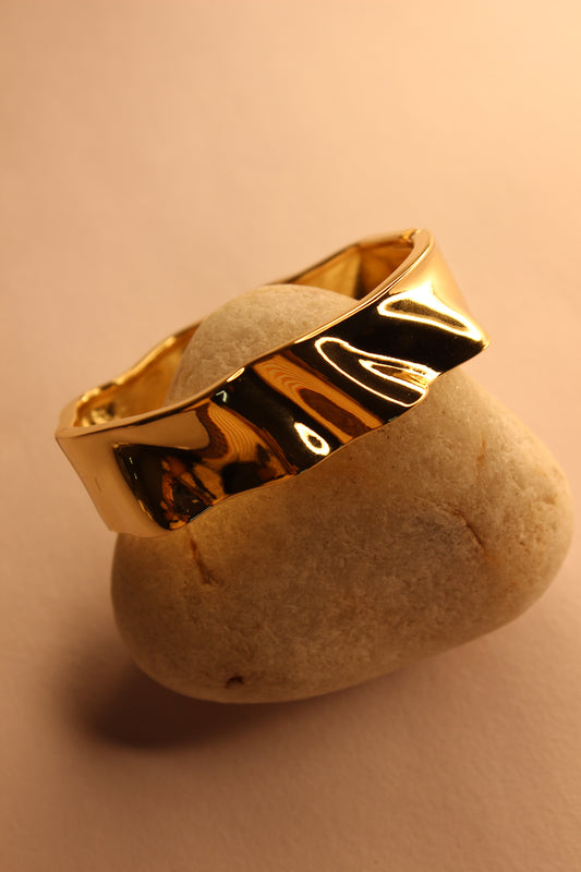 Liora Bracelet on a beige stone surface