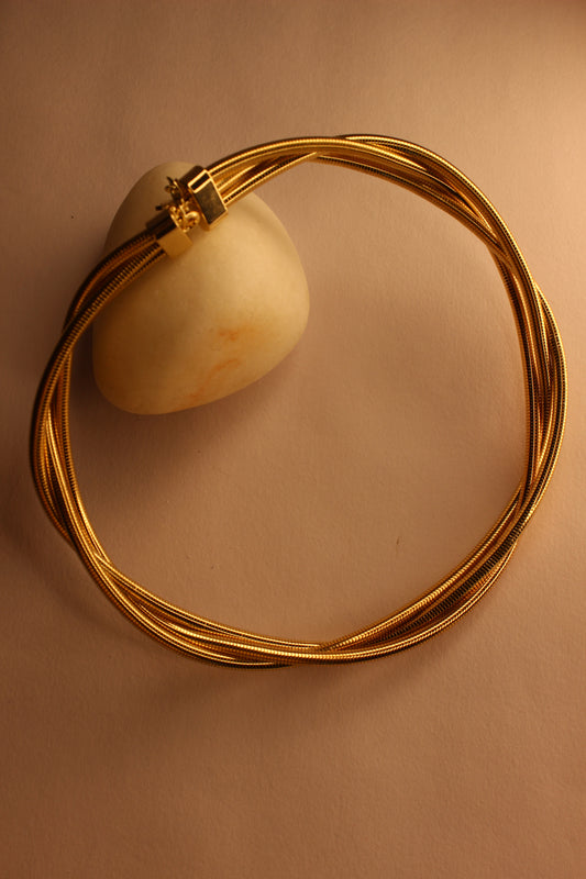 Torra Necklace on a beige background