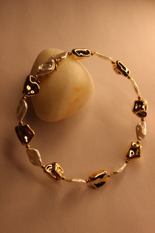 Baroqa Necklace on a beige background
