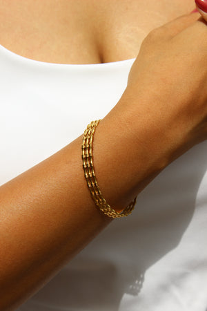 Meira Cuff Bracelet on a wrist against a white background