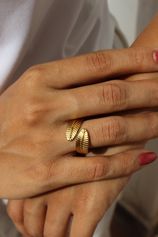 Hand wearing Adara Ring with a soft background