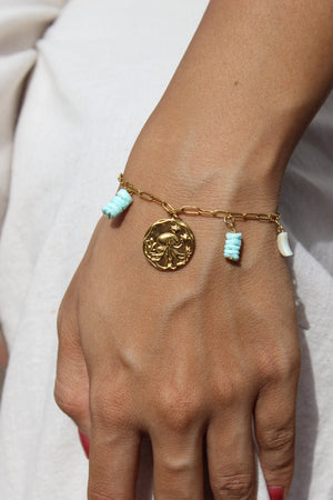 Deep Relic Charms Bracelet on a plain background