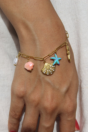 Oricca Charms Bracelet on wrist against a neutral background