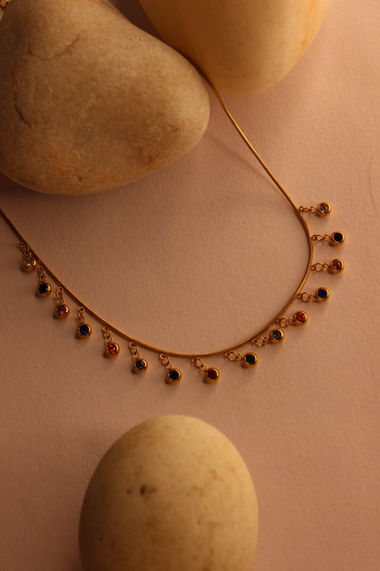 Chroma Dots Necklace on a pink background