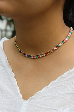 Multicolored beaded Jeweltone Parade Necklace on a model wearing a white top