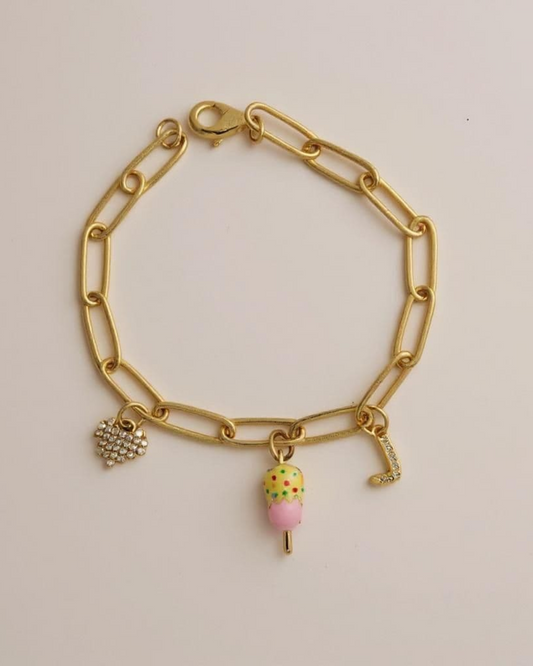 Sugar Links Charm Bracelet on a light pink background