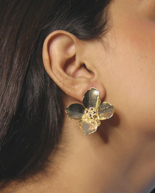 Pollene Earrings worn by a model with dark hair