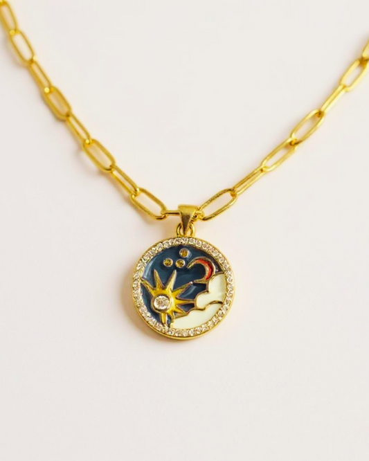 Golden Eclipse Necklace on a light gray background