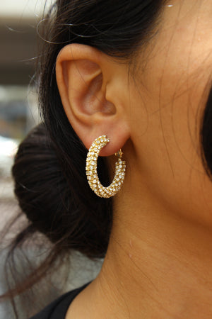 Lumira Hoop Earrings on model's ear