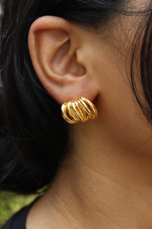 Close-up of a model wearing a Elektra Stud Earrings