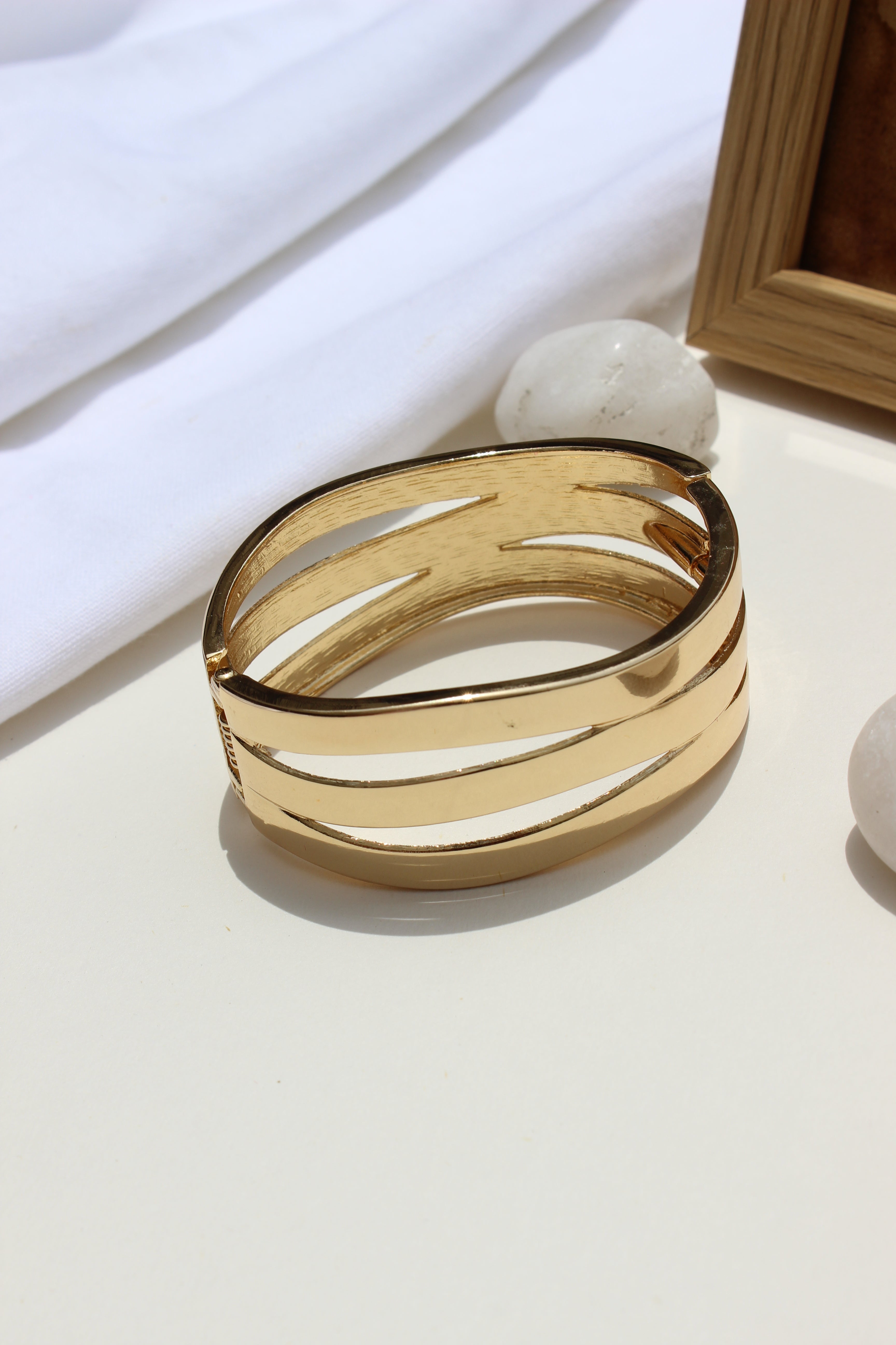 Tide Warp Bracelet on a white surface with a soft focus background