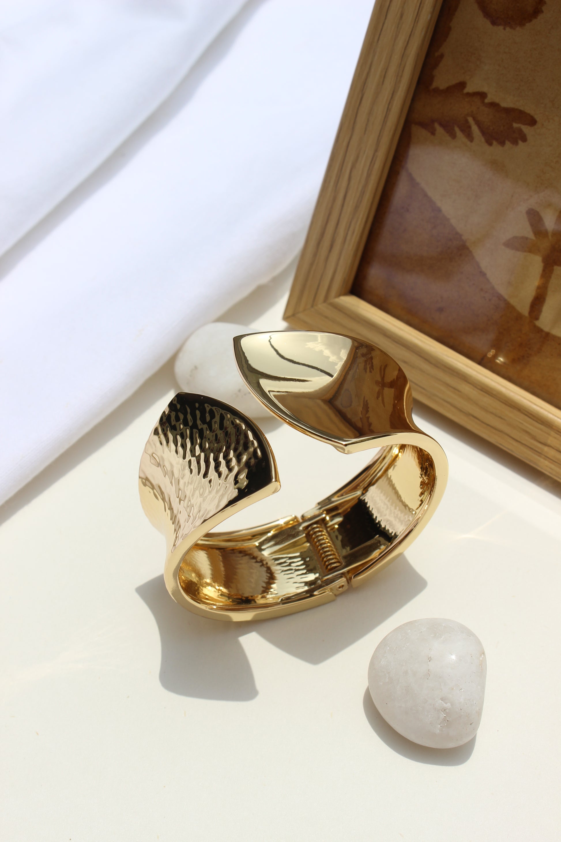 Sculpted Quiet Bracelet on a white surface with a blurred background