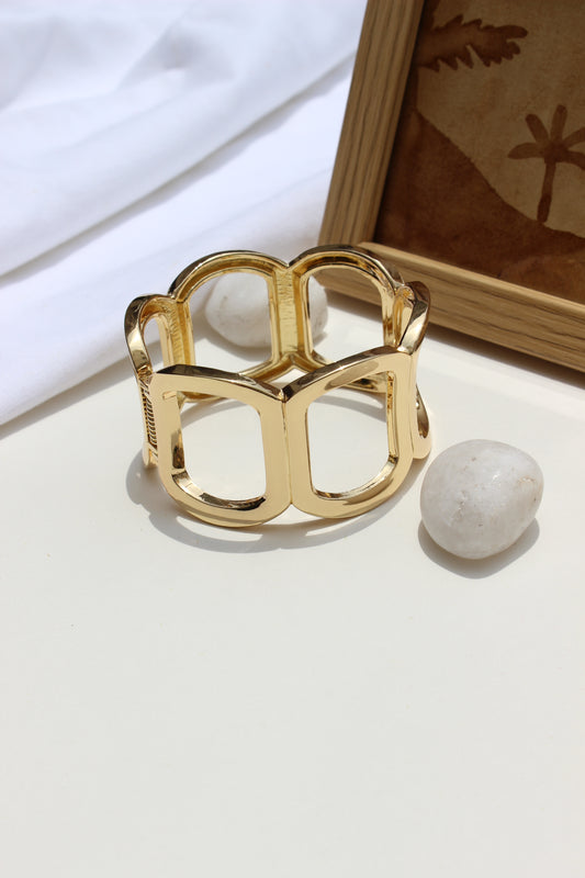 Echo Ridge Bracelet on a white surface with a wooden frame in the background